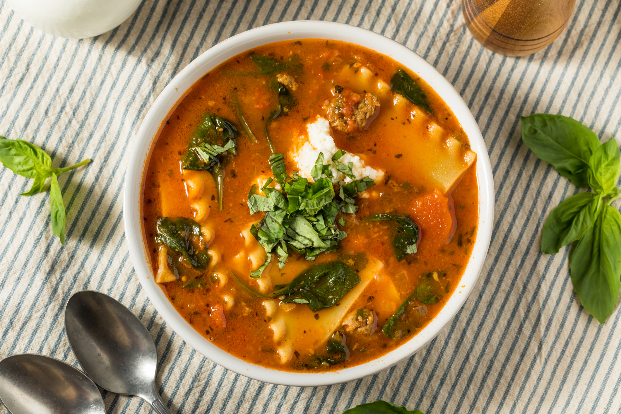 Lasagna soup with cheese and basil