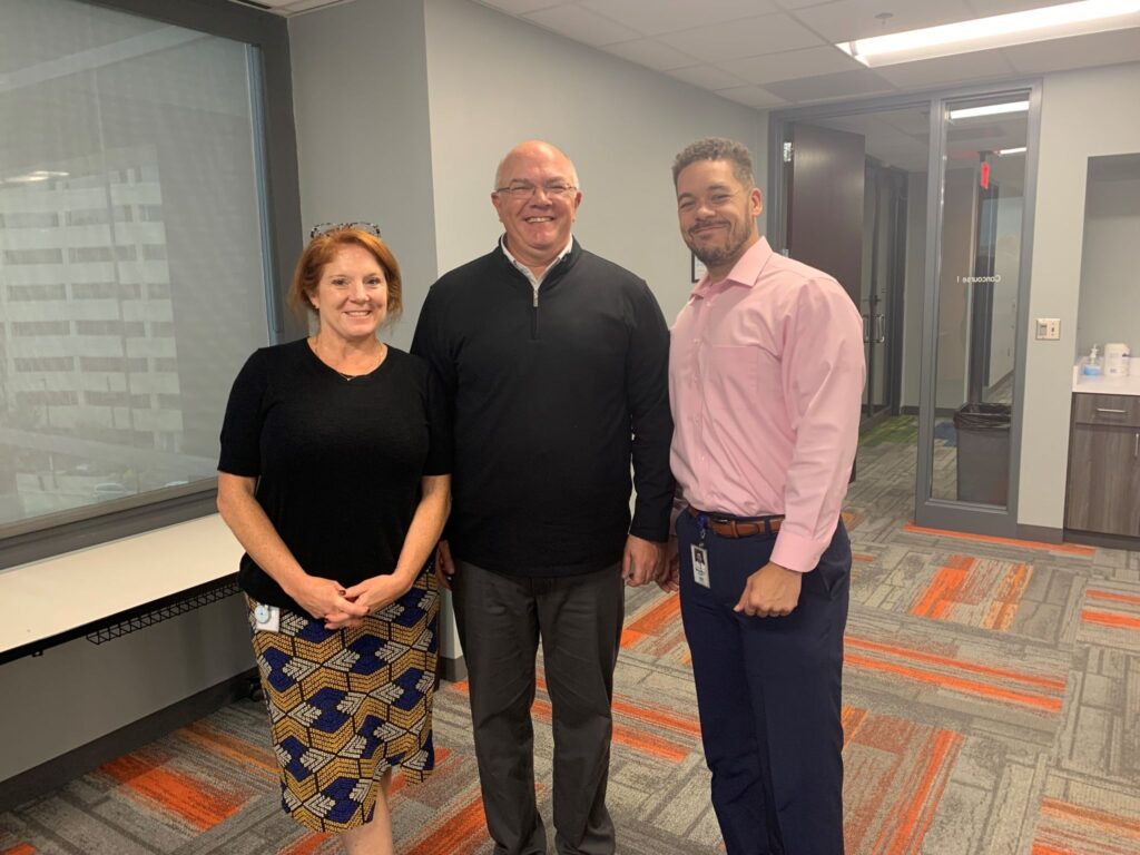 Blue KC's Wendell Cole and Kristin Gernon pose with Andy Troub from the Center for Disability Inclusion following a training on workplace accommodations in Kansas City