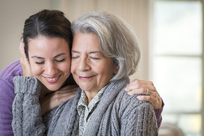 Family members hugging and smiling