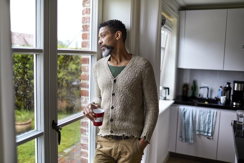 Man looking out the window