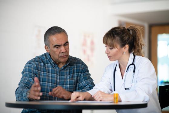 Patient talking to the doctor about colon cancer