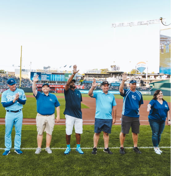 Baseball coaches posing for picture.