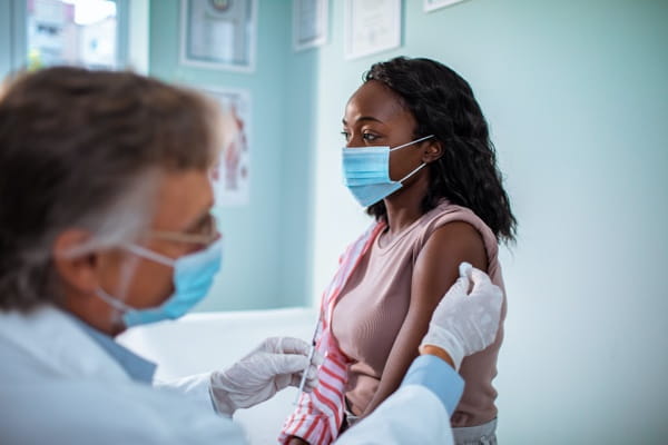 Young woman getting a COVID-19 vaccine