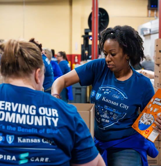 Blue KC employees volunteered at Harvesters during Volunteer Appreciation Week to package food boxes for area pantries.