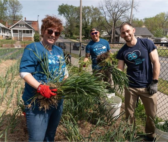 A group of people gardening.