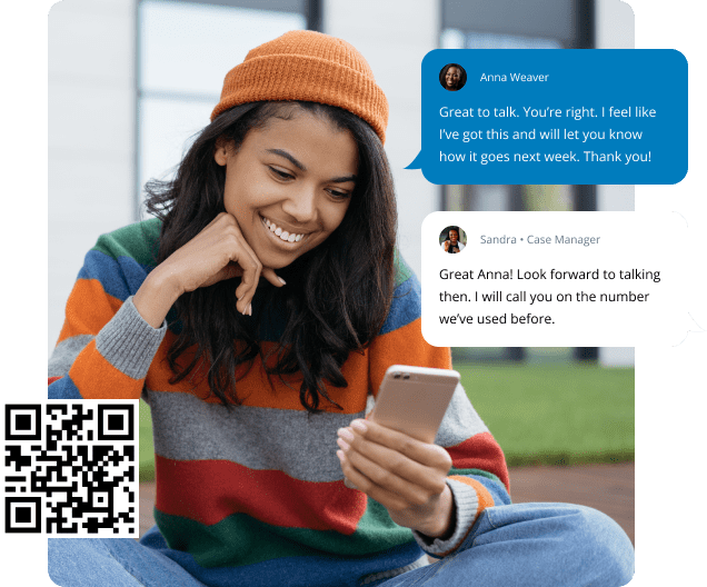 Young woman sitting down looking at her phone