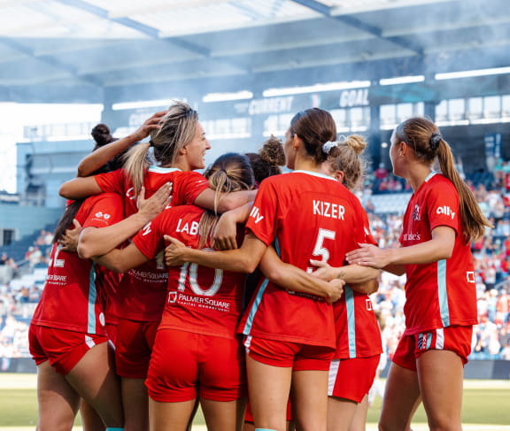 Soccer player's celebrating.